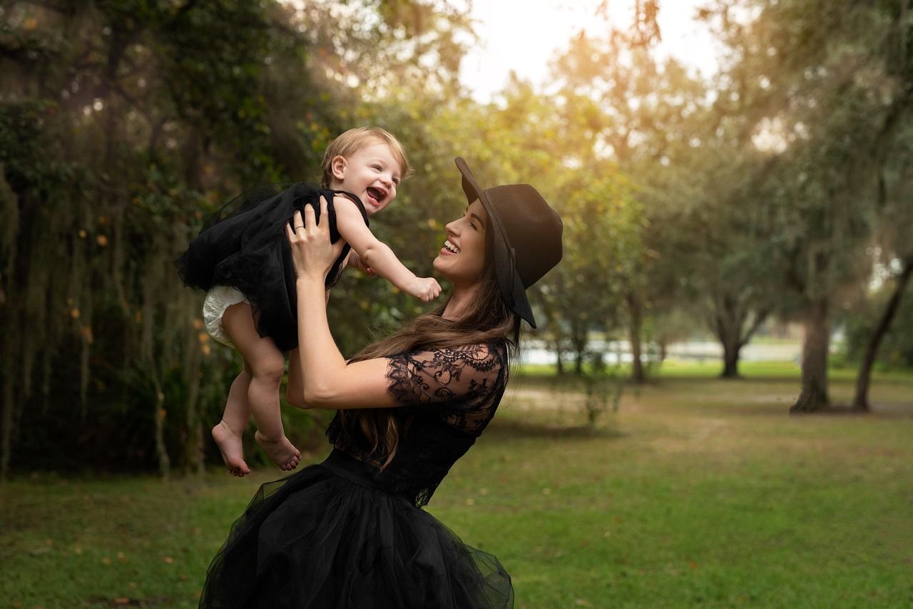 mother and daughter in black dress with cute smile