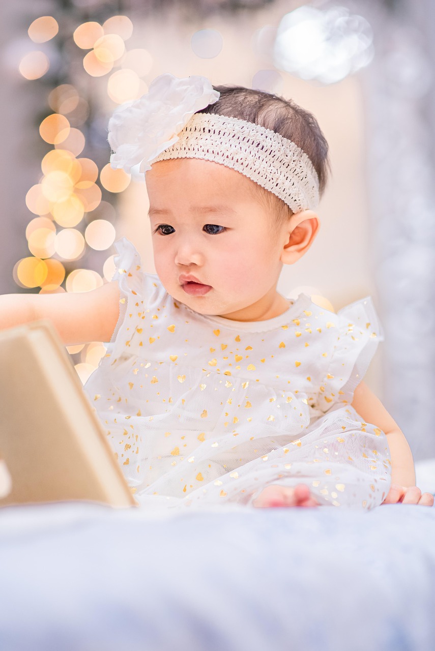 the cute baby wear in soft fabric,handled a book